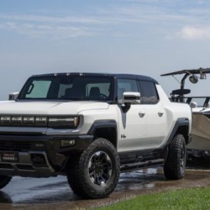 2023-GMC-Hummer-EV-Edition-1-Pickup-Press-Photos-Exterior-008-front-three-quarters-towing-720x...jpg